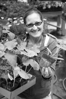 ORGANIC POTS: Jayne Fogarty shows off peat seed pots, one of the plastic alternatives offered at Springtime Garden Centre. (Photo: Emma Levez Larocque)
